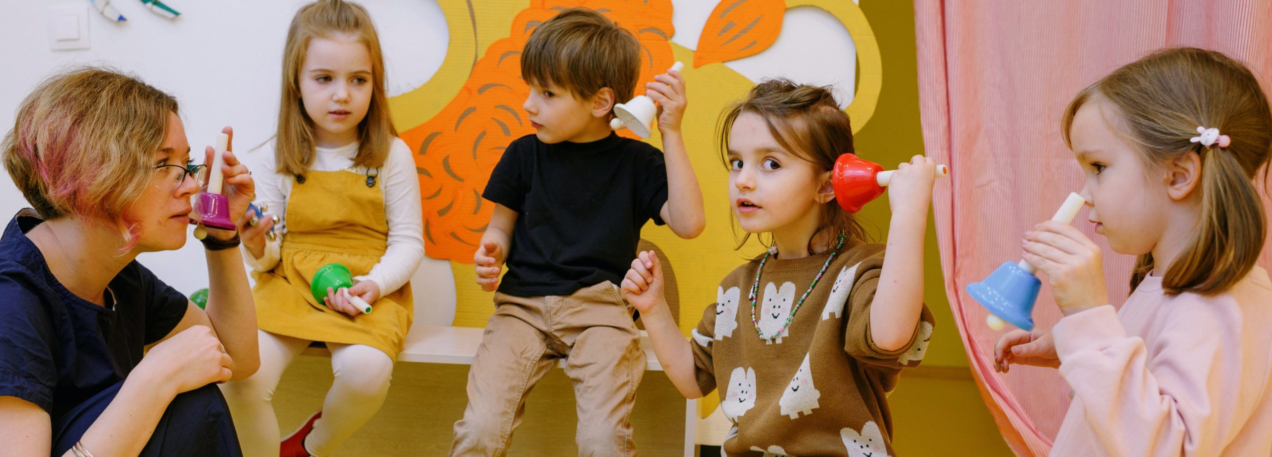 child being greeted by a line of adults